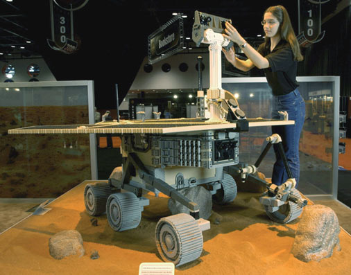 Kimberly DeRose, age 16, unveils the Mars 2003 Rover made up of more than 90,000 LEGO parts designed by LEGO Master Builders. Set for Mars exploration January 2003. (PRNewsFoto)